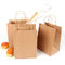 歪んだハンドルの再使用可能な買物をする紙袋が付いている再生利用できるクラフト紙袋